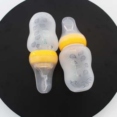 BPA free silicone squeezing feeder spoon baby silicone squeeze feeder